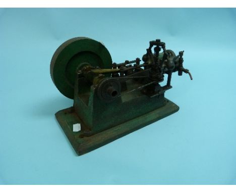 A horizontal industrial Steam Engine, on a wooden plinth, 13in (33cm) long.
