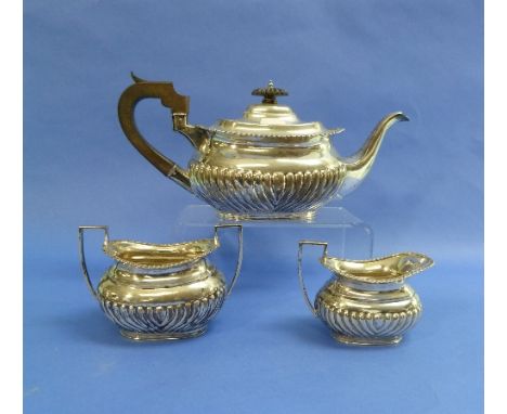 A George V silver three-piece Tea Service, by Mappin & Webb, hallmarked Sheffield, 1911, of ovoid form with demi-fluted decor