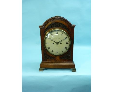 An early 19thC Bracket Clock by Reid and Auld, Edinburgh, the arched mahogany case with brass fabric-backed fretwork panels a