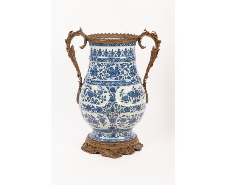 A Chinese blue and white vase, Daqing Qianlong Nianzhi mark, decorated all over with lotus, roses, peaches and waves, the bro