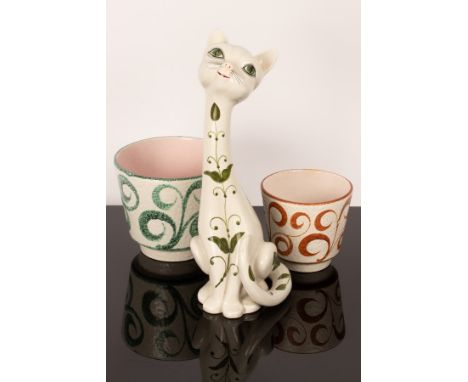 An Italian ceramic cat, circa 1960s, of tall proportions and decorated green floral details, 35.5cm high, together with two s