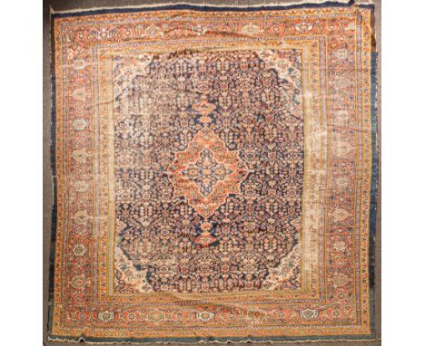 A Mahal carpet, West Persia, the indigo floral lattice field centred by a madder cartouche medallion, with ivory spandrels an