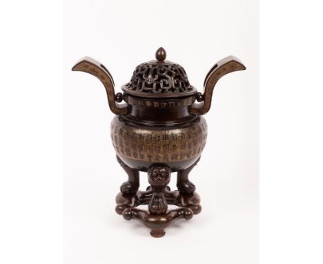 A large Chinese wooden censer, finely carved after the traditional bronze censer in the form of Chongtianer, inscribed to the