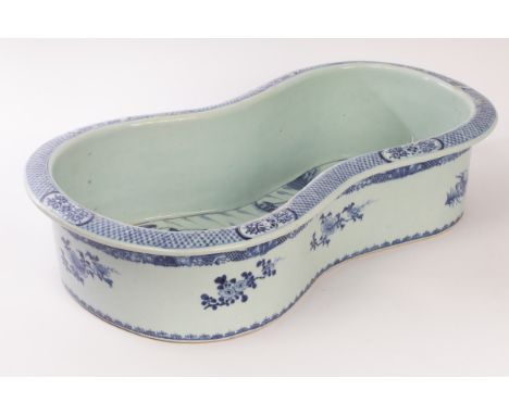 A Chinese blue and white porcelain washing basin, mid Qing Dynasty, of shaped form, decorated a landscape to the interior and