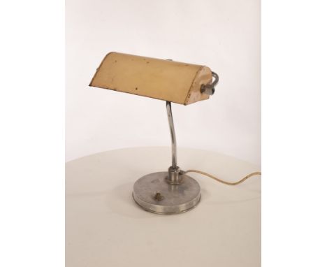 A metal desk lamp, the adjustable shade on stainless steel arm on an aluminium clad plinth base, approximately 38cm high COND