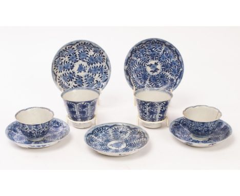 Two blue and white teabowls and two teals and five matching saucers, Qing dynasty, Kangxi period, each painted with panels of