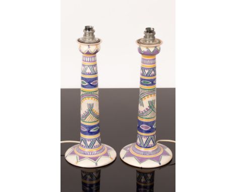 A pair of Carter Stabler Adams Poole Pottery candlesticks, painted geometric designs and a star to the base, impressed 506 an