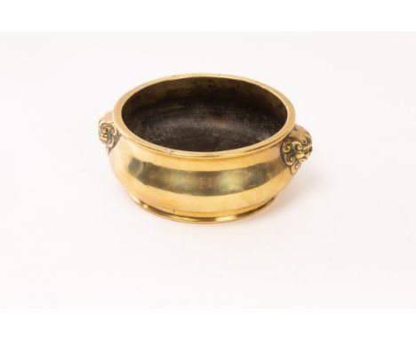 A Chinese bronze censer, Qing Dynasty, with two lion-mask handles, base mark “Daming Xuande Nianzhi”, 12cm diameter CONDITION