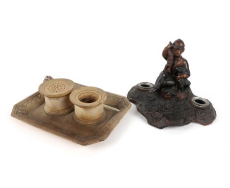 two antique ceramic inkstands, one probably English (with two wells) and one with a boy || Lot van twee antieke inktstel in f