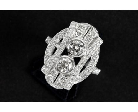 ring with a nice Art Deco design in grey gold (18 carat) with ca 1,20 carat of high quality brilliant cut diamonds || Ring me