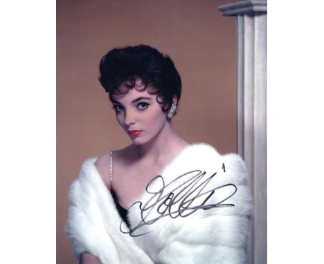 Joan Collins, legendary TV and movie actress signed 8x10 sexy portrait photo. Good Condition. All autographs are genuine hand