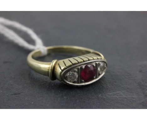 A ruby and diamond ring; set with on a 14ct gold band