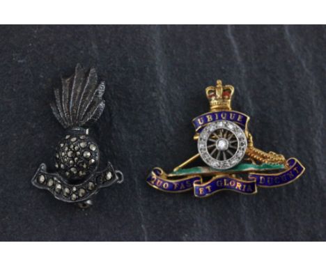 A 9ct yellow gold and enamel Royal Artillery brooch with diamonds; together with a silver and marcasite Royal Fusilier's broo