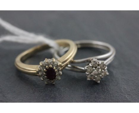 A ruby set 9ct yellow gold ring together with another white metal ring