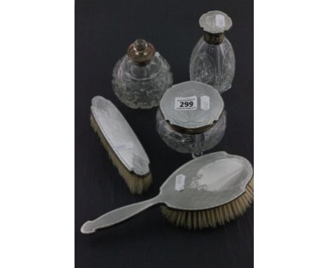 A hallmarked silver and enamel four piece dressing table set; together with sterling silver scent bottle; of spherical form