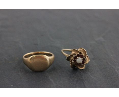 Two 9ct yellow gold rings; to include opal and garnet