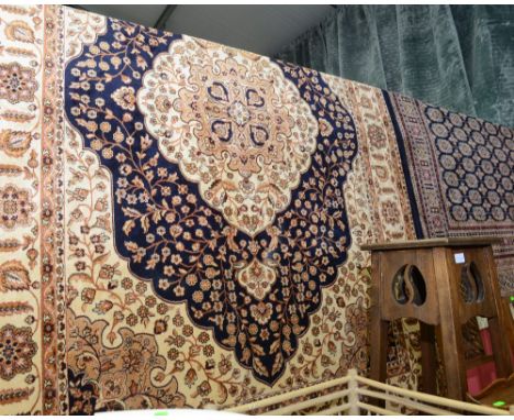 A Kum style carpet with blue ground. 2.3m x 1.6m
