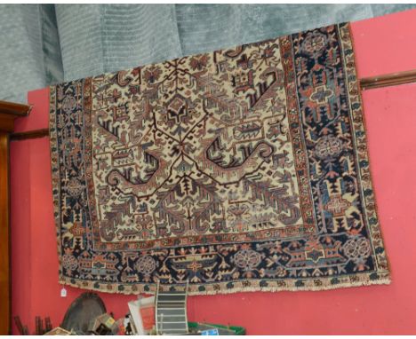 An antique Persian Heriz carpet. 2.79m x 1.90m