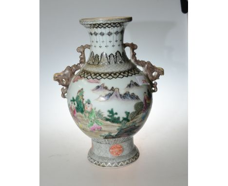 A Chinese porcelain twin handled baluster vase decorated with children playing and with six character mark to base, 33cm high