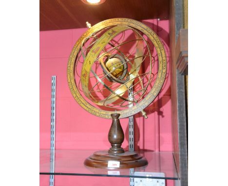 A mahogany based table astrological globe