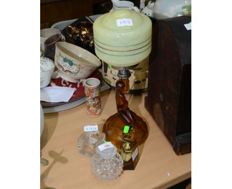 A 1920s Art Deco amber glass table lamp; tog. with three glass scent bottles