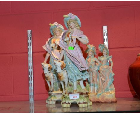 A group of three Continental bisque figures