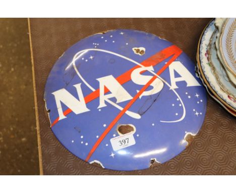 A reproduction Nasa enamel sign