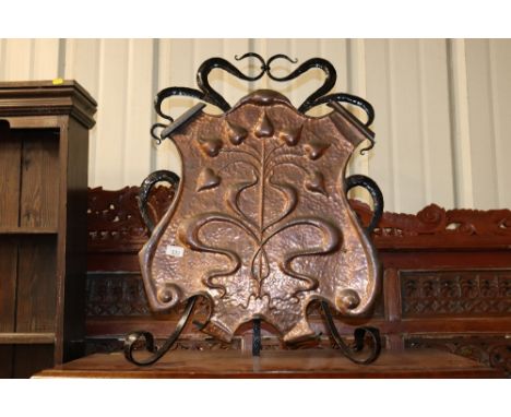 An Arts and Crafts wrought iron and copper firescreen