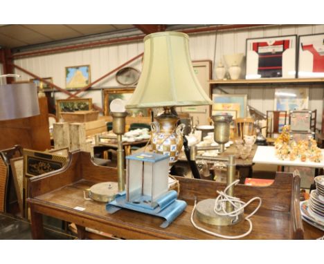 A gilt and floral urn table lamp and shade; a pair of brass table lamps etc