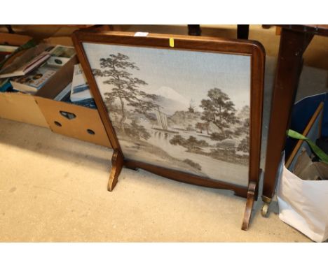 A Japanese silk fire screen contained in mahogany frame