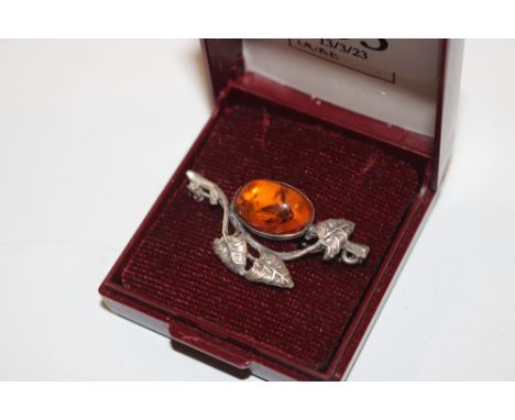 A sterling silver and amber set Art Nouveau brooch