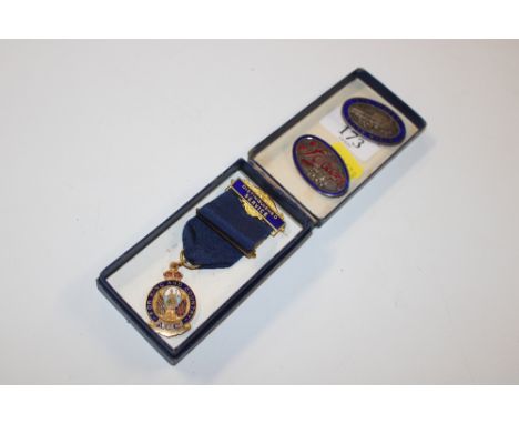 Two enamel decorated Foden badges and a yellow metal and enamel decorated Distinguished Service medal