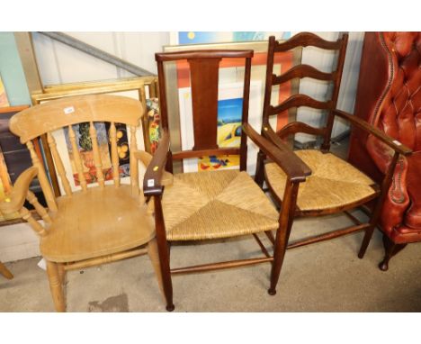 A mahogany ladder back elbow chair with rush seat