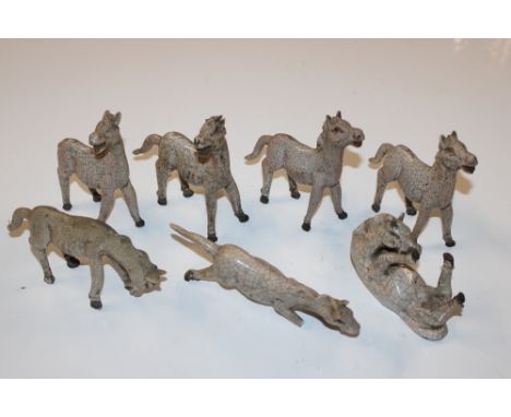 A collection of crackle glazed model horses