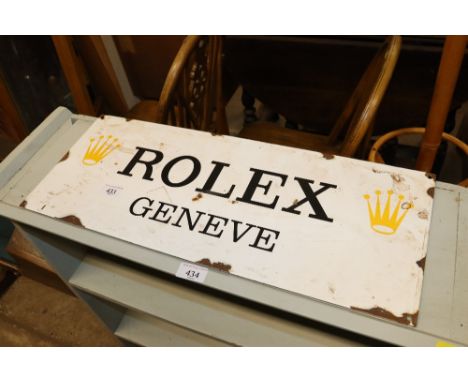 A reproduction Rolex enamel sign