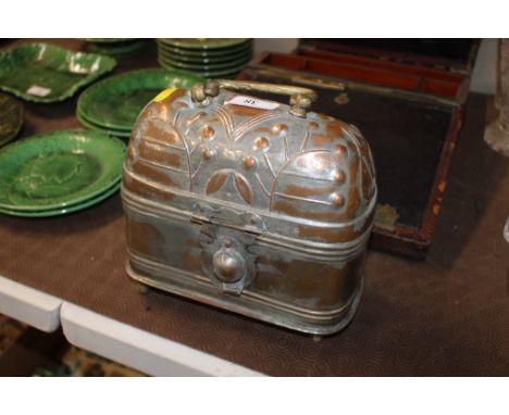 A copper and plated caddy with brass swing handle