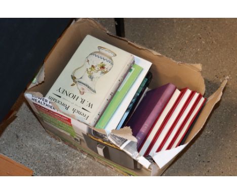 A box containing various art reference books etc