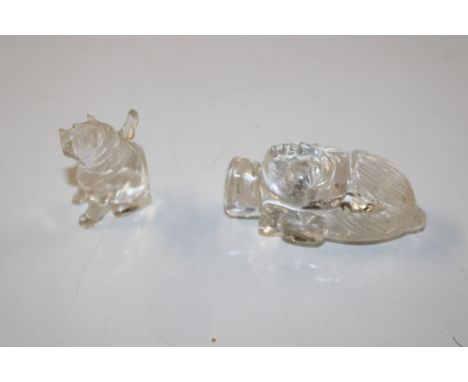 A rock crystal model of a Buddha's head and similar model of a dog