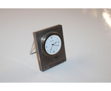 A silver cased R J Carr clock