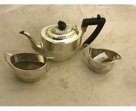 A late Victorian silver three-piece breakfast tea service,  by W W  Harrison, Sheffield 1895 and 1900, of oval part-fluted fo