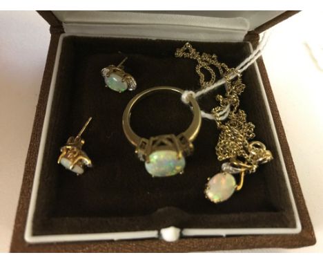 A 9ct opal ring; together with earrings and pendant