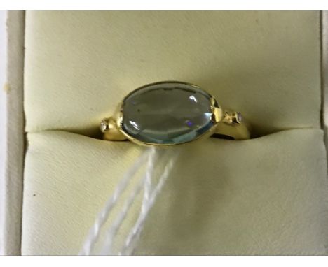 An 18ct oval cabochon morganite dress ring