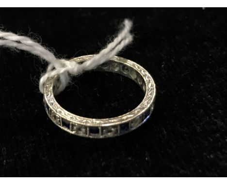 A 9ct blue and white stone eternity ring