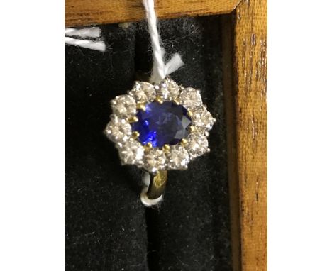 An 18ct diamond and sapphire dress ring, central Ceylon sapphire, approx 1.5ct