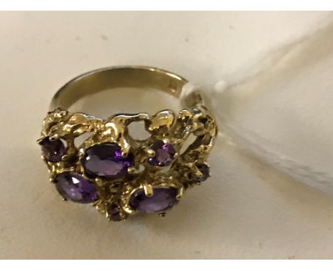 A 9ct amethyst set abstract ring