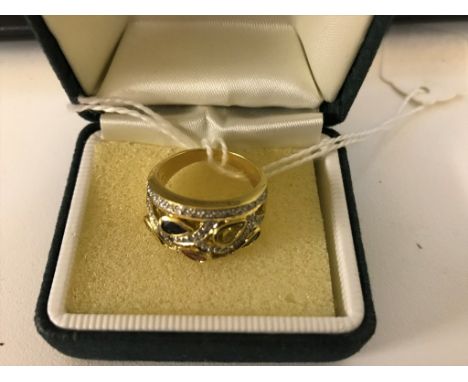 An 18k multistone dress ring