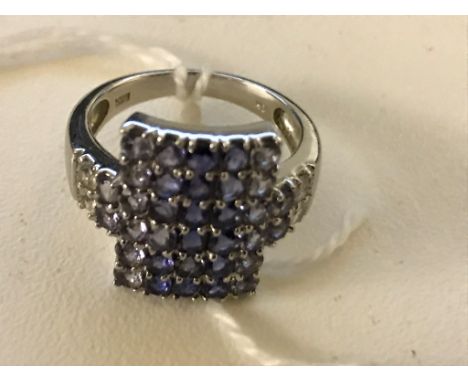A 10k multi-stone set dress ring