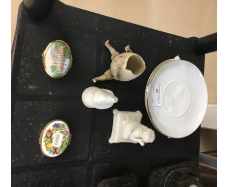 A bisque candle snuffer, Humpty enamel boxes and bisque plates