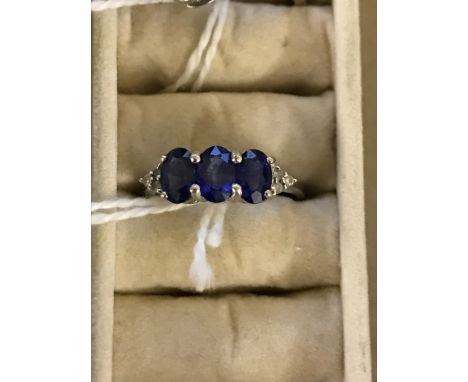 A 14ct diamond and sapphire dress ring