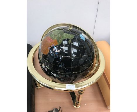 A large semi-precious set globe in gilt stand